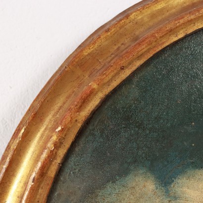 Tableau ovale avec scène maritime