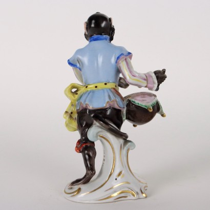 Mono orquestal de porcelana de