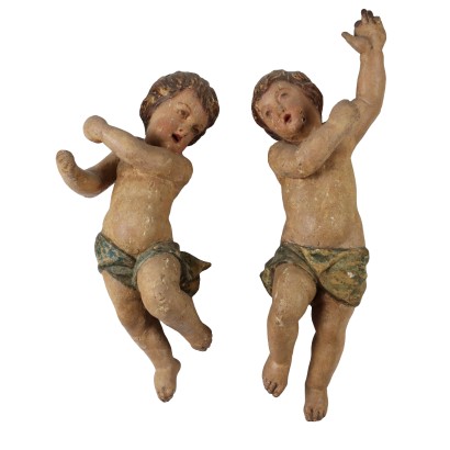 Par de putti de madera tallada