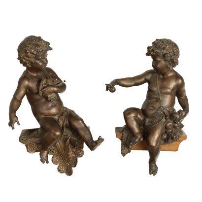 Par de putti de bronce