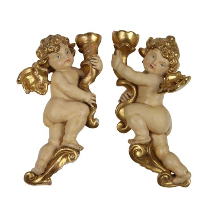 Coppia di Putti in Legno Intagliato