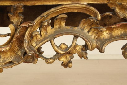 Richly carved, gilded console table leg moves, marble top, polished, shaped portoro