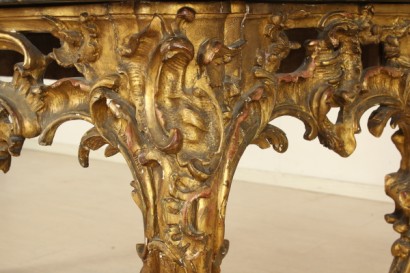 Richly carved, gilded console table leg moves, marble top, polished, shaped portoro
