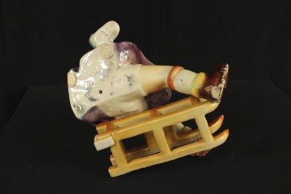 Garçon en céramique de traîneau à chiens