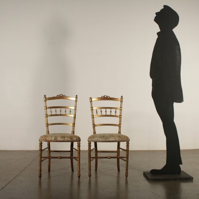 Paar Stühle mit Goldenen