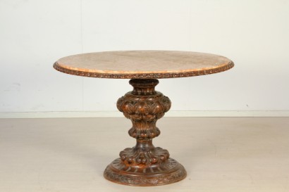 Round table in carved wood and marble