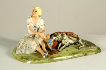 Donna seduta sul Prato con i Cani