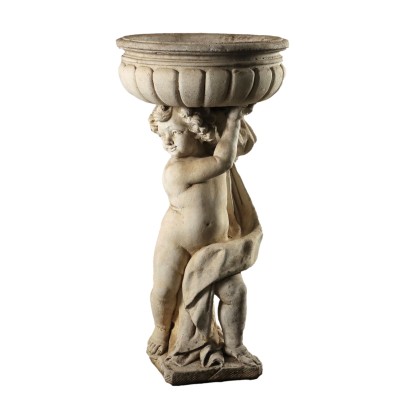 Caja de flores con putto en la ronda